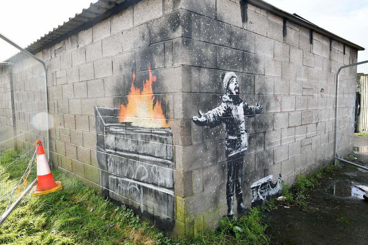 Banksy Painting Walls. An Unauthorized Exhibition